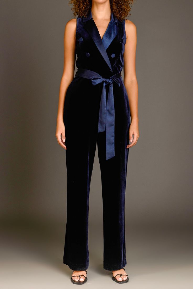 You deserve the elegance of a wrap jumpsuit this season. This satin lapel collar wrap jumpsuit is a guaranteed way to up your style game. With a self-belt and wide legs, this number is sleek and timeless. Step out in confidence knowing you look effortlessly chic in our Satin Collar Velvet Jumpsuit. Belted wrap jumpsuit Satin lapel collar Self-belt Wide leg Side hidden in-seam zip closure Lined Hand wash cold Do not bleach Do not tumble dry Iron low Shell: 100% Polyester Contrast: 100% Polyester Pink Velvet Jumpsuit, Formal V-neck Belted Jumpsuit, Jumpsuit Satin, Chic Purple V-neck Jumpsuits And Rompers, 70s Velvet Jumpsuit, Blue V-neck Relaxed Fit Jumpsuit, Belt Wide, Wrap Jumpsuit, Velvet Jumpsuit