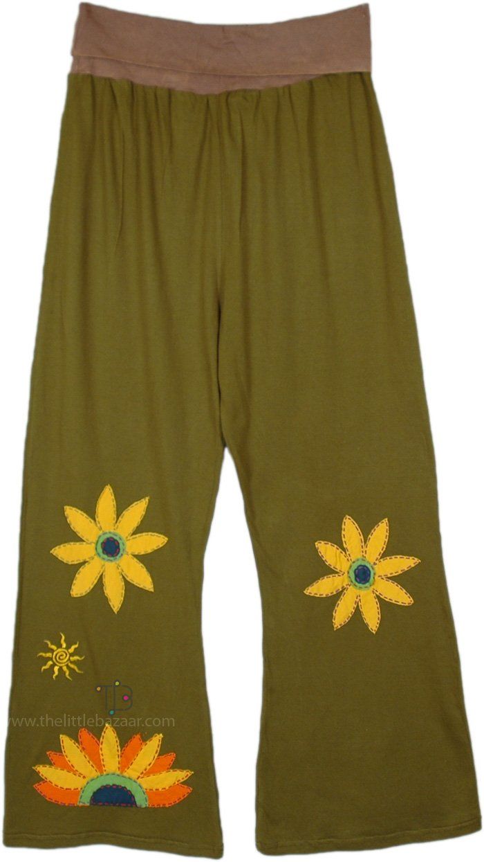 A funky pair of pants in soft cotton sinker fabric with beautiful sun or sunflower handmade motifs embroidered.  These cotton pants feature a flexible and comfortable yoga waist, they drape in a slight bell-bottom style. #tlb #SplitSkirtsPants #Embroidered #bohemianfashion #Handmade #BohemianPants Cotton Flare Yoga Pants With Stretch, Stretch Flare Cotton Yoga Pants, Flare Stretch Cotton Yoga Pants, Casual Flare Cotton Yoga Pants, Cotton Flare Pants For Festivals, Festival Flare Cotton Pants, Fitted Cotton Yoga Pants For Summer, Hippie Embroidered Bottoms For Summer, Hippie Cotton Flare Pants