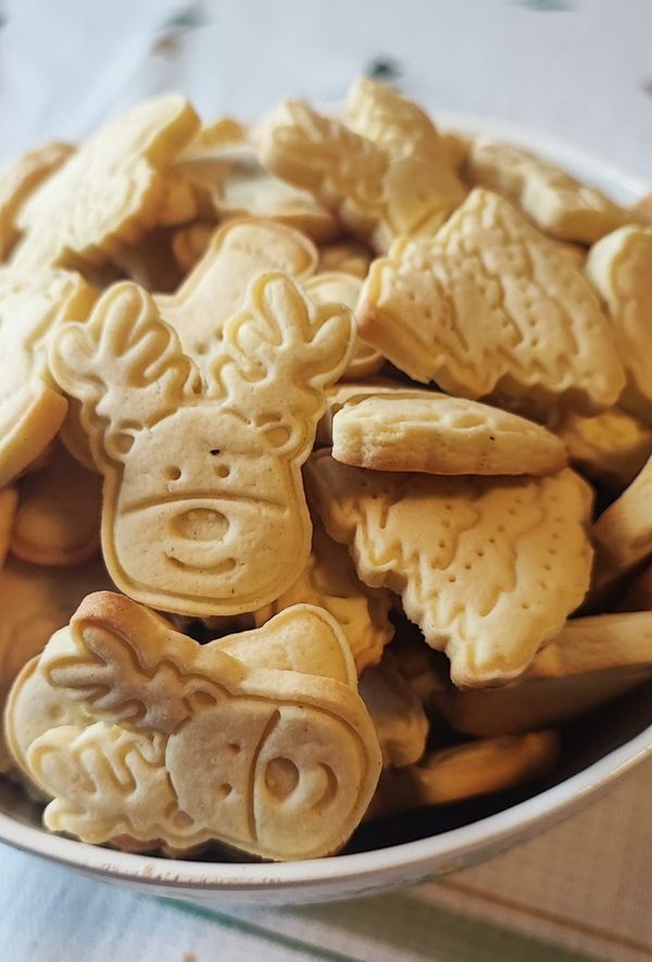 a bowl filled with cut out animal cookies