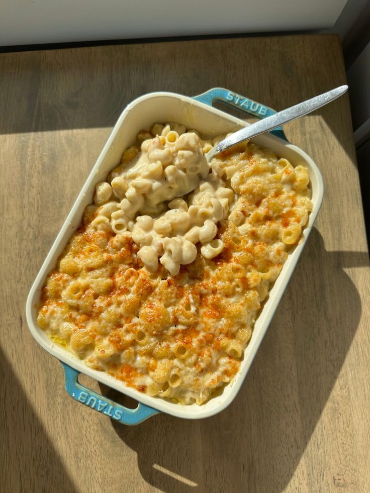 a casserole dish with macaroni and cheese in it on a table