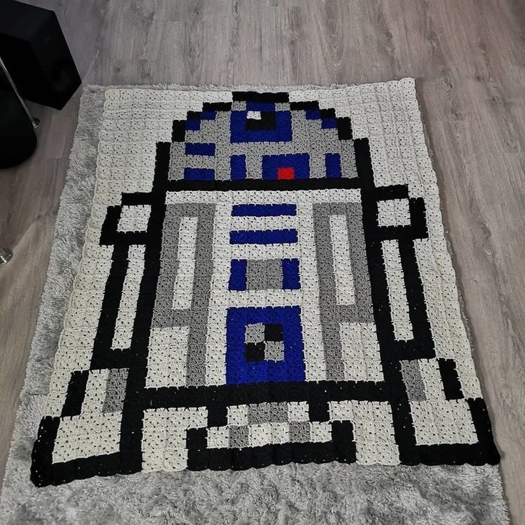 a star wars themed rug is on the floor