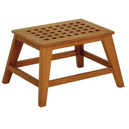 a wooden step stool with lattice design on the top