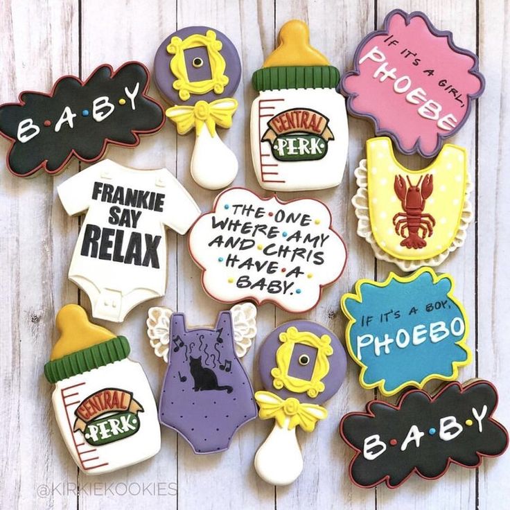 decorated cookies are arranged in the shape of baby's names and other things to eat