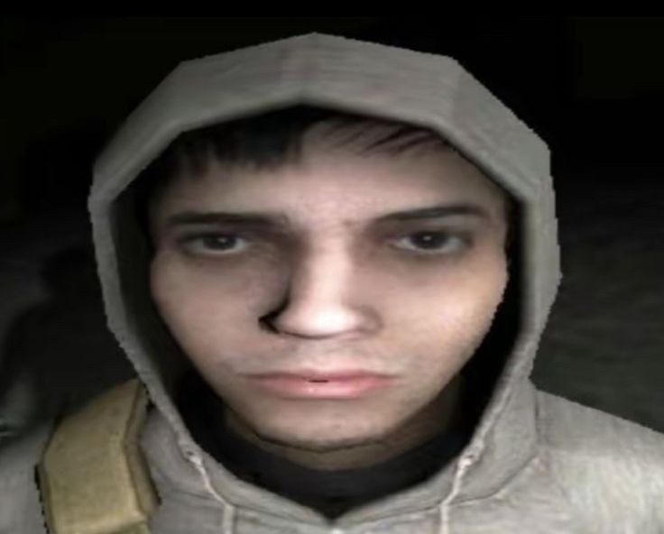 a man wearing a hoodie looking at the camera with an intense look on his face