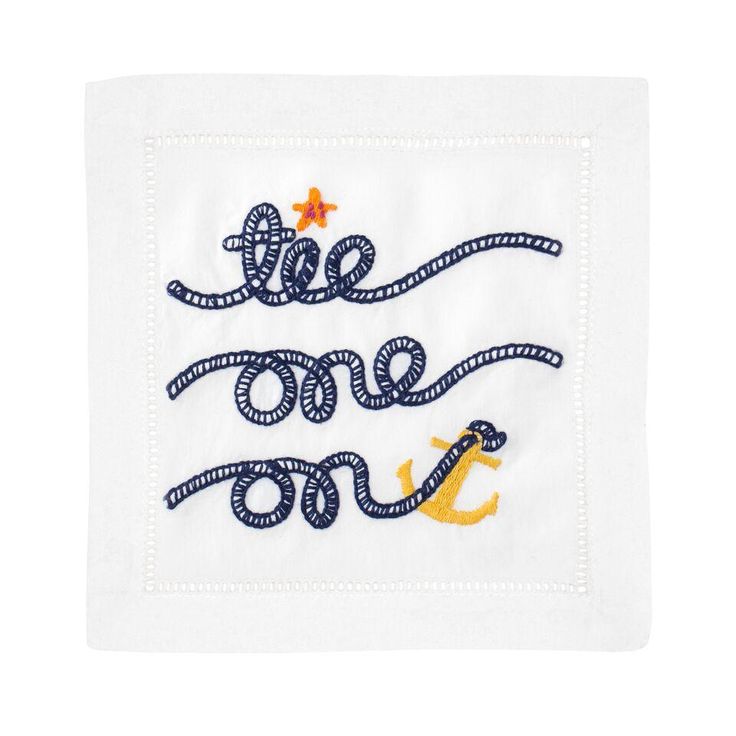 an embroidered napkin with the words,'we are one'written in blue and yellow