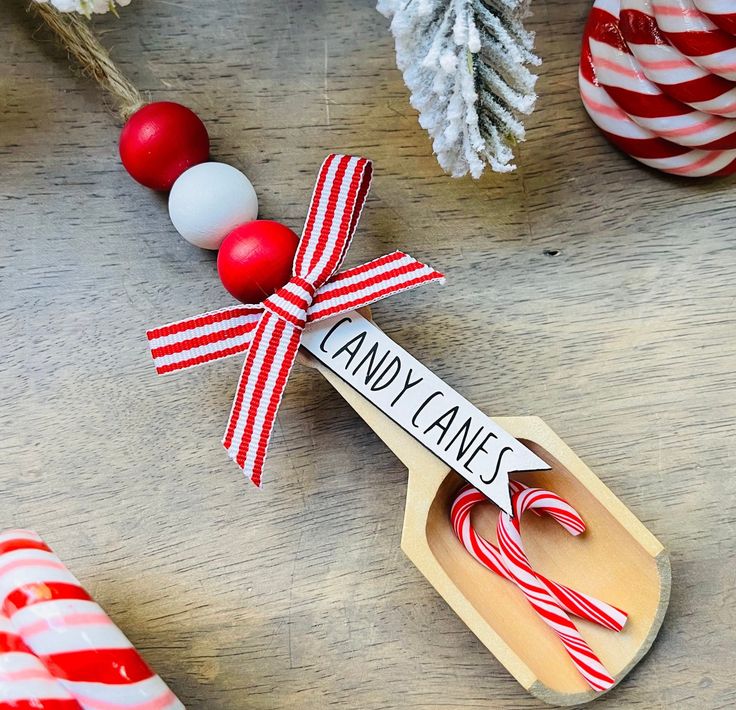 a wooden spoon with candy canes on it