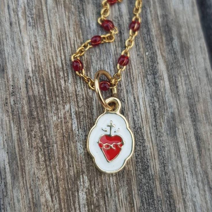 "Sacred Heart Gold Pendant Charm. Beautiful and super cute pendant-charm made in 18k gold, not plated, not filled. This piece is solid, not hollow. Use it in a necklace with lots of charms, alone or in a bracelet. This is truly a piece you can pass down to your younger generations as a keepsake. SIZE Tall: 0.72\" / 18.4mm (aprox. including bail) Wide: 0.34\" / 8.8mm (in the widest part) Come follow us on Instagram as @orommajewelry and @shinyhappylily to see many more amazing pieces and to get d Yellow Gold Heart Necklace With Vintage Charm, Valentine's Day Vintage Charm Necklaces, Dainty Charms With Lobster Clasp For Gifts, Heart-shaped Yellow Gold Jewelry With Dangling Charms, Yellow Gold Heart-shaped Jewelry With Dangling Charms, Gold Plated Charms With Lobster Clasp As Gift, Gold Plated Charms With Lobster Clasp For Gift, Heart Pendant Charm Necklace Perfect For Gift, Dainty Vintage Charm Jewelry For Valentine's Day