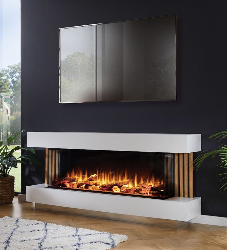 an electric fireplace in a living room with a mirror above it