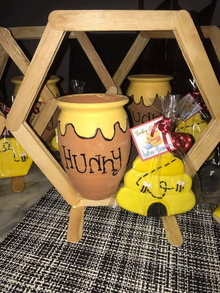 a group of yellow vases sitting next to each other on top of a rug