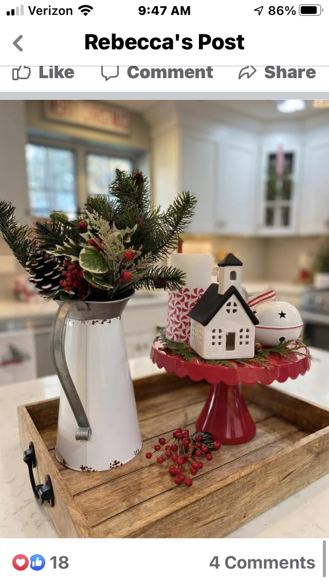 a tray with christmas decorations on it and a coffee pot sitting on top of the tray