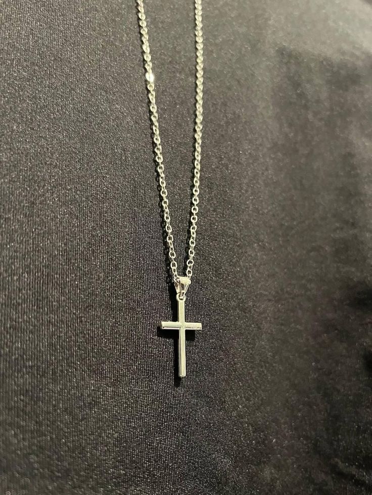 The Serene Cross is a stunning piece that captures the essence of tranquility and divine grace. Crafted by Christians, this cross pendant exudes an elegant simplicity that makes it a timeless accessory. The clean lines and smooth finish give the Serene Cross a sophisticated, minimalist aesthetic, perfect for everyday wear or special occasions. Minimalist Cross Pendant Necklace With Clavicle Chain, Minimalist Clavicle Cross Chain Jewelry, Minimalist Cross Pendant Necklace As Gift, Minimalist Cross Necklace With Clavicle Chain, Minimalist Clavicle Chain Crucifix Jewelry, Minimalist Crucifix Clavicle Chain Jewelry, Silver Minimalist Cross Necklace With Clavicle Chain, Elegant Silver Cross Necklace For Everyday, Elegant Everyday Silver Cross Necklace