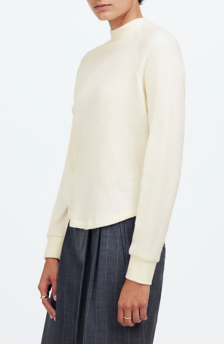 Made of cozy, textural waffle knit, this long-sleeved tee features a ribbed crew neckline and sporty raglan sleeves. Laid-back and oversized, it's the perfect blend of cute and comfy. 22 1/2" length (size Medium) Crewneck Long sleeves 50% viscose, 30% polyester, 20% polyamide Machine wash, dry flat Imported Spring Textured Knit Long Sleeve Crew Neck Top, Spring Crew Neck Long Sleeve Top With Textured Knit, Casual Long Sleeve Textured Knit Top With Crew Neck, Sporty Ribbed Sweater For Spring, Sporty Ribbed Spring Sweater, Ribbed Crew Neck Long Sleeve Top For Everyday, Everyday Ribbed Crew Neck Long Sleeve Top, Spring Crew Neck Waffle Knit Top, Relaxed Fit Long Sleeve Waffle Knit Sweater