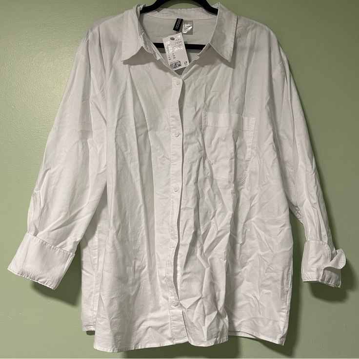 This White Button Down Shirt From H&M Is Available Now Brand New With Tags! This Shirt Is A Bright White With White Buttons And Cuffed Sleeves. This Shirt Is Part Of Their Divided Collection And Is Available Now In A Women’s Xl. Willing To Negotiate! Approximate Measurements: - Armpit To Armpit: 26.5 Inches - Shoulder To Hem: 27 Inches H&m Relaxed Fit Shirt With Buttons, H&m Relaxed Fit Shirt With Button Closure, H&m Relaxed Fit Collared Shirt, White Button-up Top With Roll-up Sleeves, H&m Collared Shirt With Button Closure, H&m Shirt With Button Closure For Spring, H&m Button Closure Shirt For Spring, H&m White Relaxed Fit Shirt, White Relaxed Fit Shirt By H&m