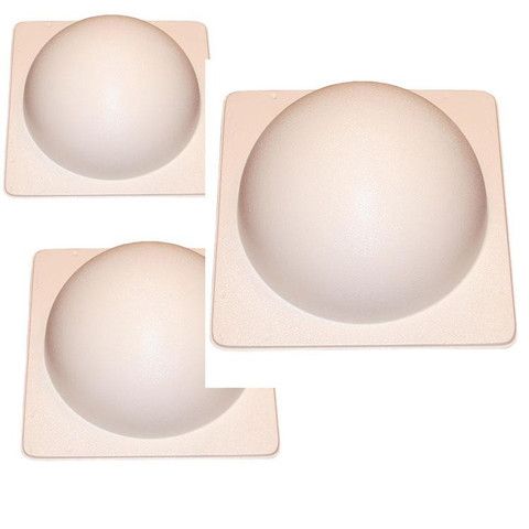 three white eggs sitting on top of each other in the shape of an egg tray