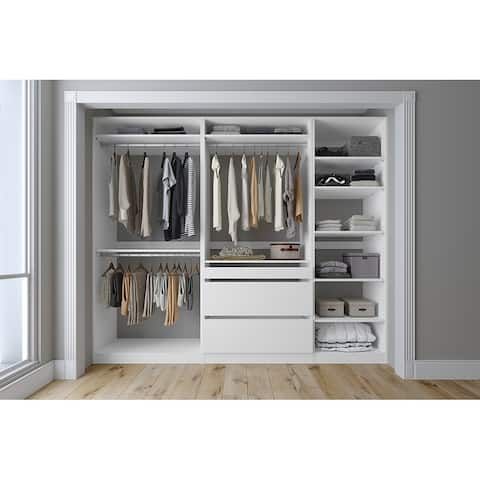 an open closet with clothes and other items