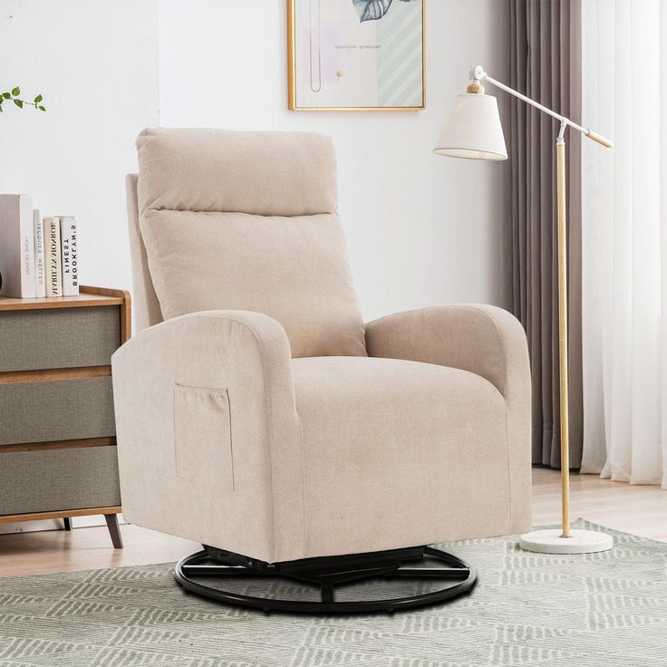 a beige recliner chair sitting on top of a rug