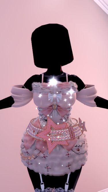 a mannequin wearing a pink dress with stars and bows on it's chest