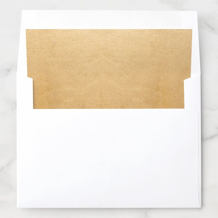 a white envelope with gold foil on it