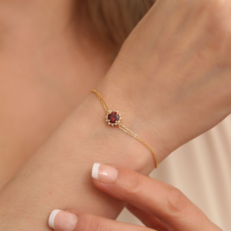 Discover the essence of true love with our Garnet Bracelet, a masterpiece of 14K solid gold adorned with real diamonds, an ultimate symbol of affection. A perfect Valentine's Day gift, this piece highlights January's birthstone in its most luxurious form. Gift authenticity, gift elegance. Garnet; It is a stone shown as the representative of passion, true friendship, loyalty, success and consistency. Our 14K Solid Gold Garnet bracelet surrounded by Real Diamonds is a stylish jewelery for you and Elegant Gemstone Bracelet As A Gift, Dainty Brilliant Cut Tennis Bracelet As A Gift, Elegant Gemstone Bracelet Gift, Timeless Cubic Zirconia Chain Bracelet Gift, Fine Jewelry Brilliant Cut Chain Bracelet As Gift, Elegant Yellow Gold Chain Bracelet With Gemstone, Yellow Gold Diamond Bracelet With Gemstone, Classic 14k Gold Gemstone Tennis Bracelet, Classic 14k Gold Tennis Bracelet With Gemstones