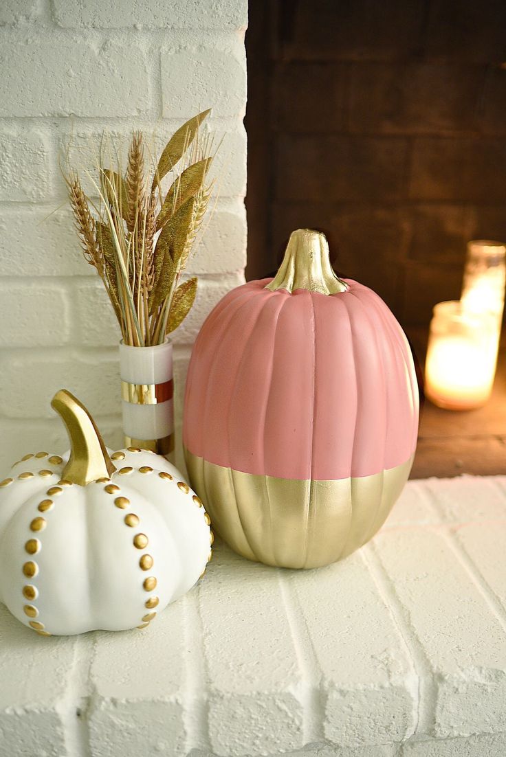 two decorative pumpkins sitting next to each other