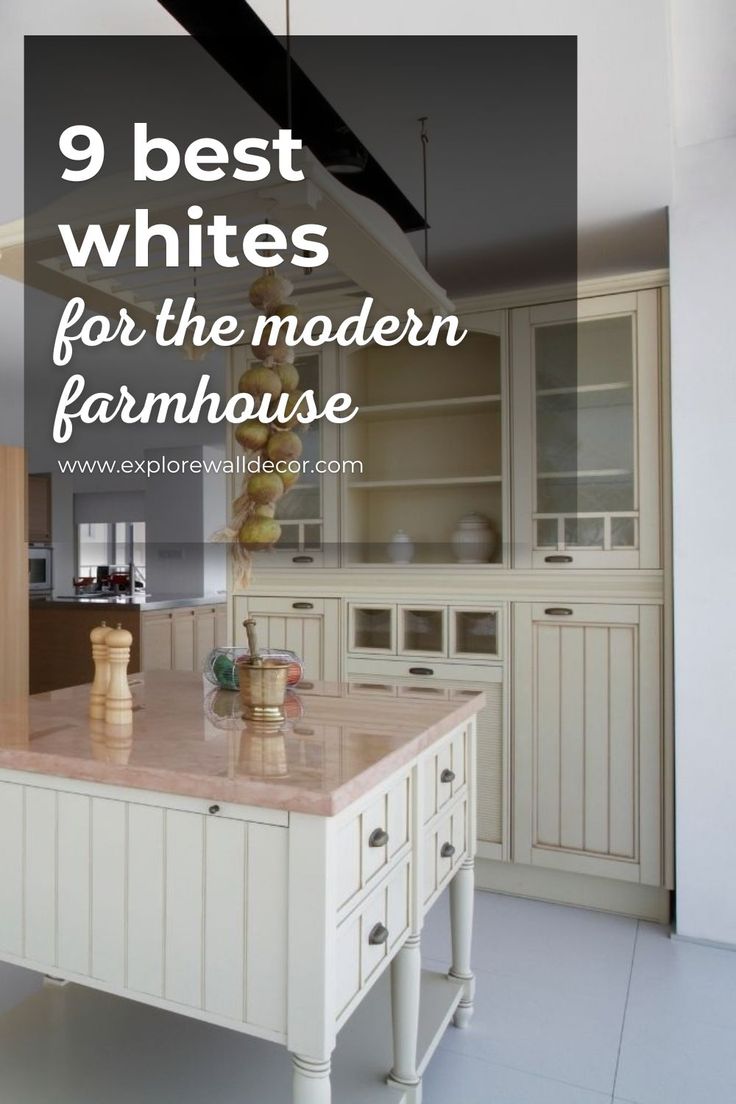 a large kitchen with white cabinets and marble counter tops in front of an open floor plan