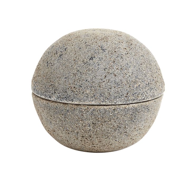 a round stone container on a white background