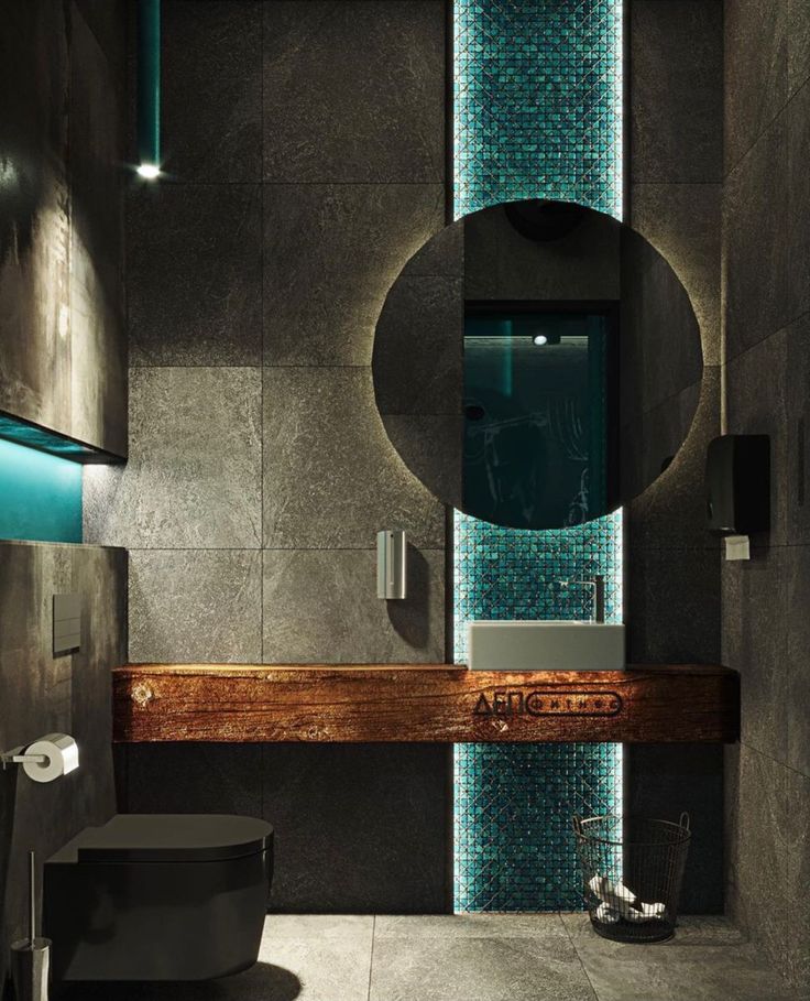 a bathroom with a sink, mirror and toilet in the corner next to a tiled wall