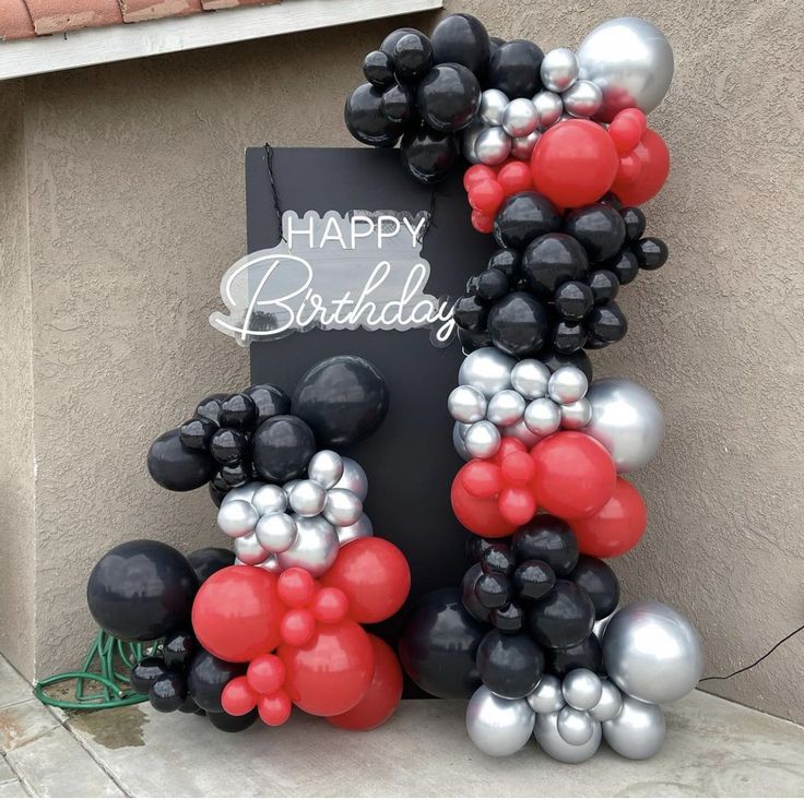 a happy birthday sign made out of balloons