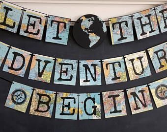 the adventure begins banner is hanging on a door with an earth globe in the background