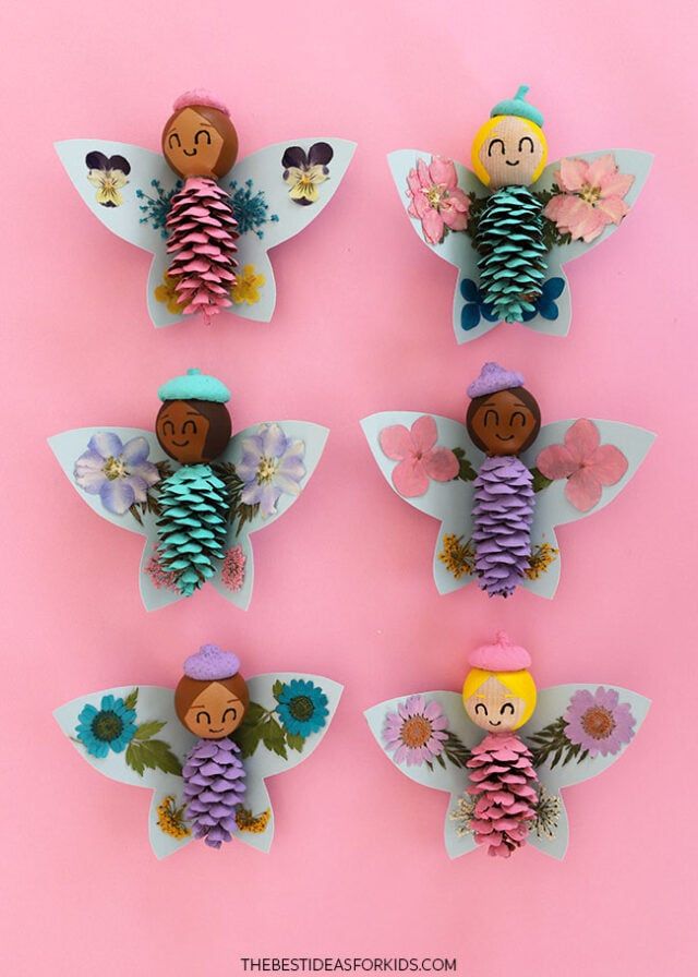 the paper angel craft is made with pine cones