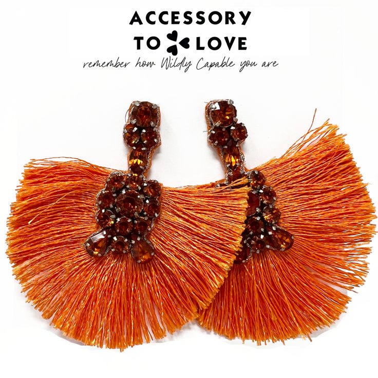 The beauty and diversity of life found in coral reefs reminds us of the beauty and diversity among women. Let's strive to embrace the beauty we find in our diverse backgrounds. The Coral Reef Lobe Love Statement Earrings remind us that together life is discovered. This orange statement earring is sure to make your spring & summer bright. Length: 2.75" Width: 2.5" Gold Hardware Stud Back Closure Fringe and Gemstones Purple is pre-order Bohemian Orange Tassel Earrings For Party, Orange Earrings For Beach With Pierced Ears, Orange Earrings For Beach, Summer Orange Drop Earrings, Orange Drop Earrings For Beach, Orange Drop Earrings For The Beach, Trendy Orange Dangle Earrings, Orange Party Earrings For Pierced Ears, Trendy Orange Drop Earrings