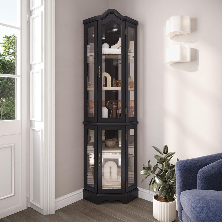 a tall black corner cabinet with glass doors