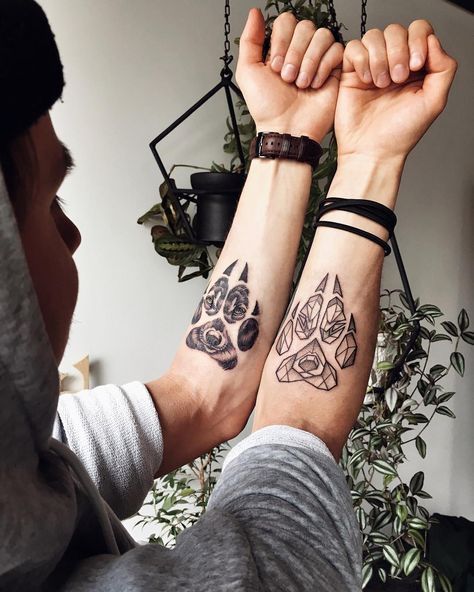 two people with matching tattoos on their arms