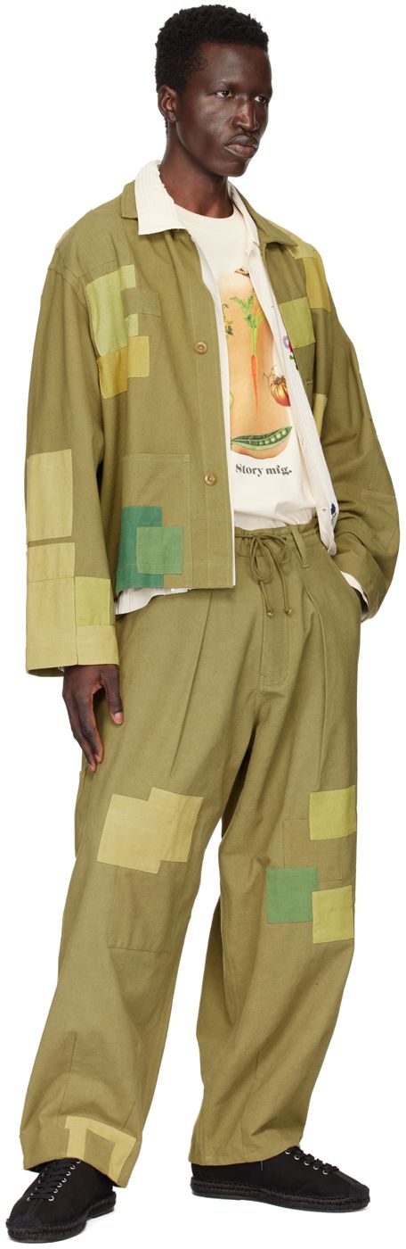 Lightweight plain-woven kaduka-dyed slub organic cotton jacket. Patchwork detailing throughout. · Spread collar · Button closure · Patch pockets · Unlined · Naturally-dyed corozo nut hardware Supplier color: Olive loved Green Cotton Button-up Utility Jacket, Green Relaxed Fit Outerwear With Patch Pockets, Green Cotton Utility Jacket For Work, Green Cotton Outerwear With Patch Pockets, Green Utility Jacket With Pockets And Relaxed Fit, Khaki Cotton Blazer With Patch Pockets, Green Cotton Utility Jacket With Button Closure, Green Cotton Utility Jacket With Buttons, Spring Utility Blazer With Patch Pockets