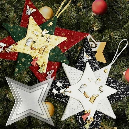 three star ornaments hanging from a christmas tree