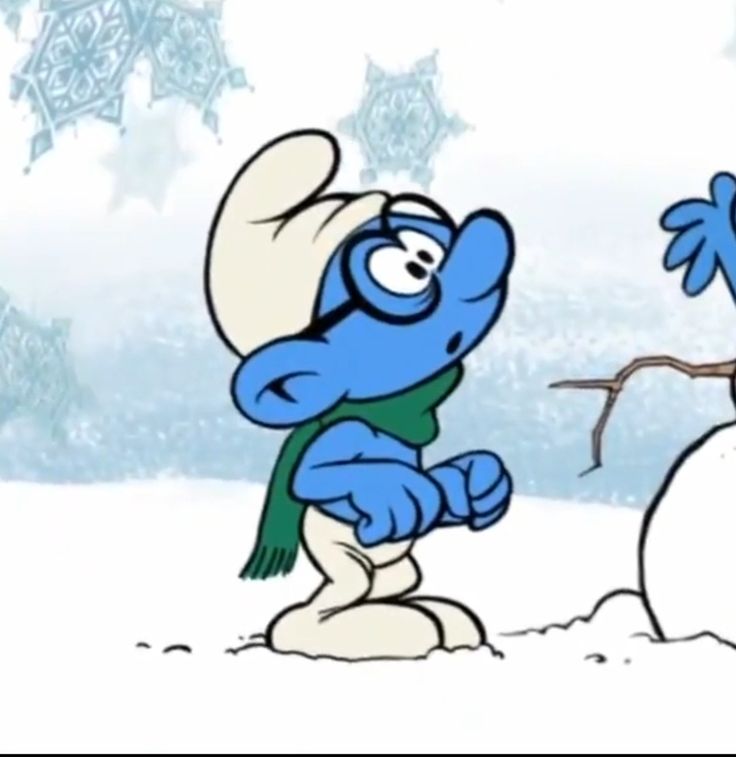 the smurfs are playing with each other in the snow