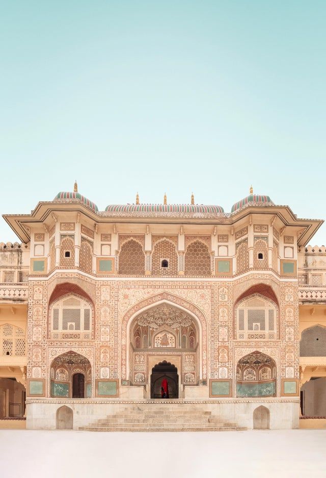 an ornate building with many windows and doors