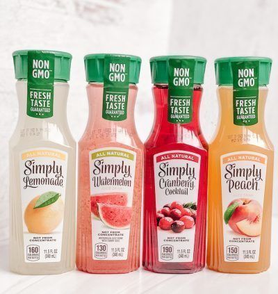 four bottles of simply gourmet juice are lined up