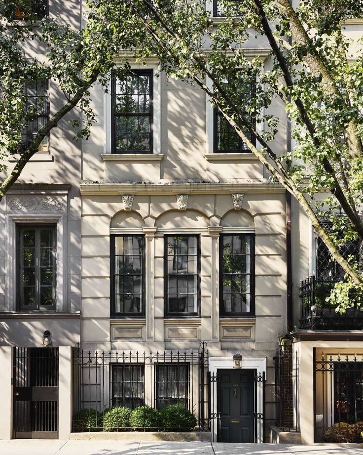 an apartment building with many windows and doors