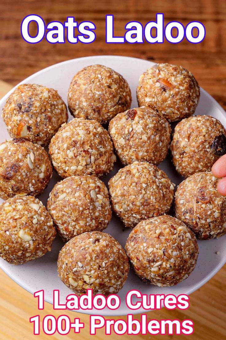 a plate full of ladoos on a wooden table with text overlay that reads, 1 laboro cures 100 + problems