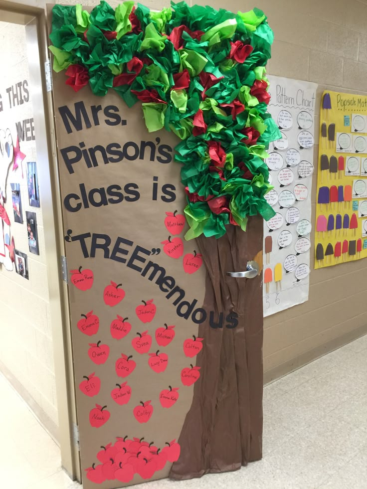 a classroom door decorated to look like an apple tree