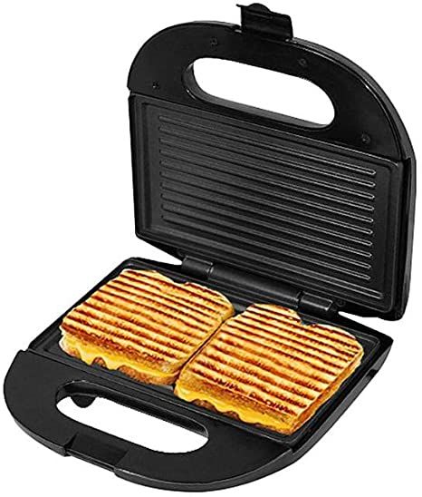 two grilled sandwiches in a black panini maker