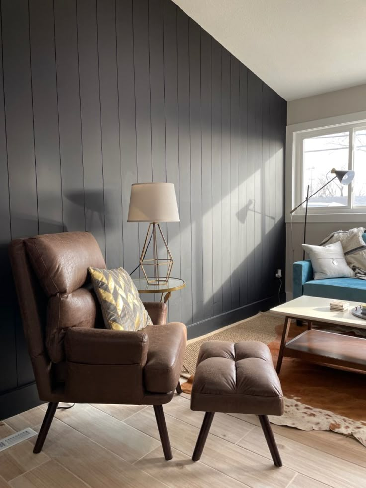 a chair and ottoman in a living room