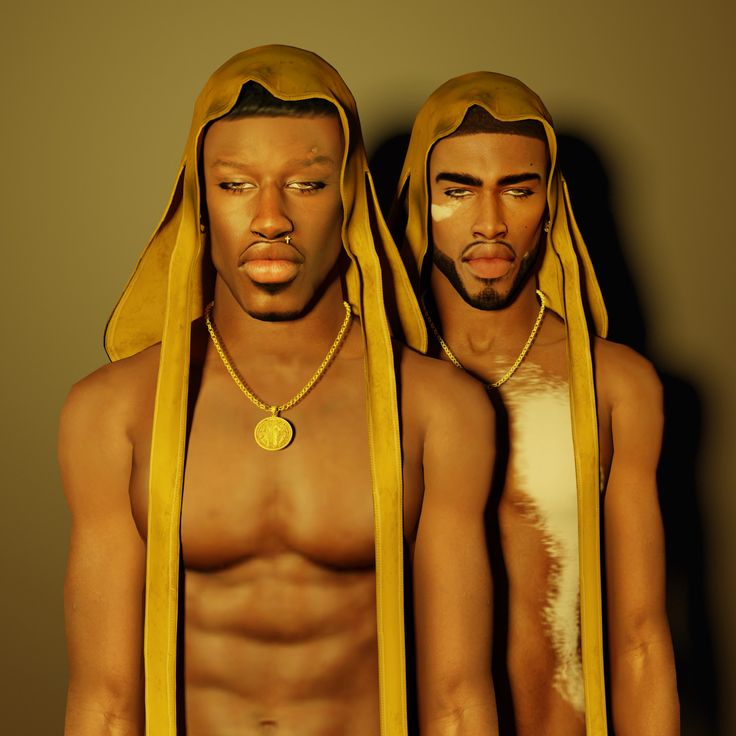 two men wearing yellow cloths and gold necklaces are standing next to each other