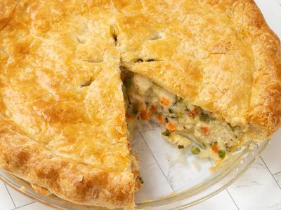 a chicken pot pie with one slice cut out