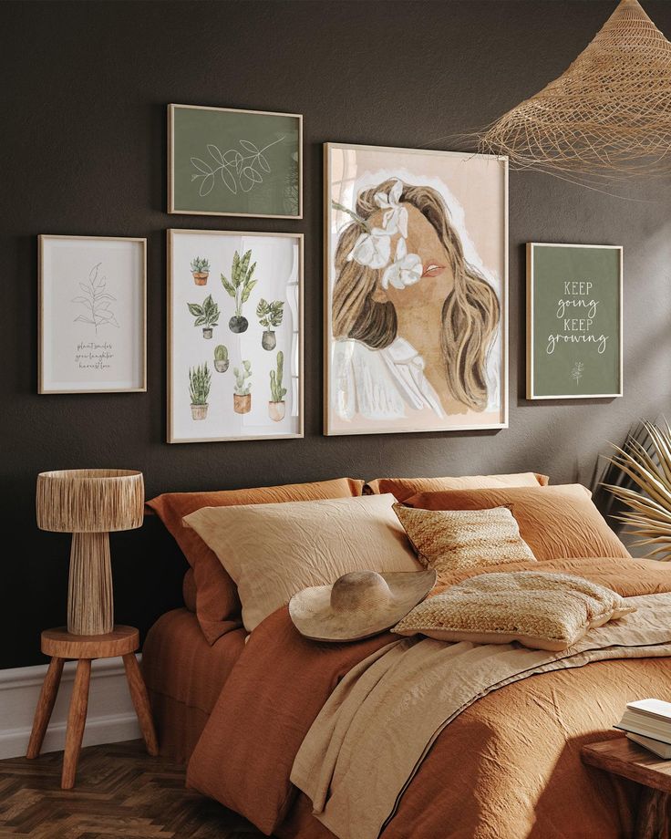 a bedroom with pictures on the wall above the bed