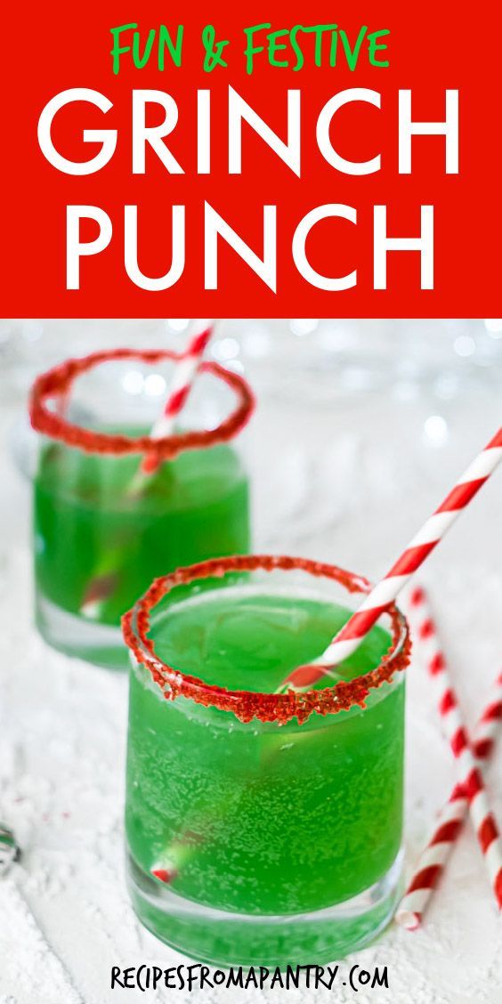 two glasses filled with green punch and candy canes