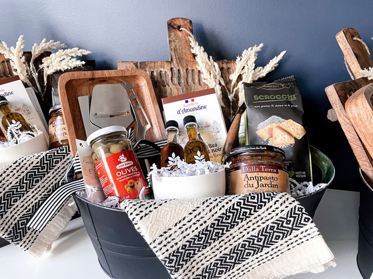 two baskets filled with food sitting on top of a counter next to a cutting board