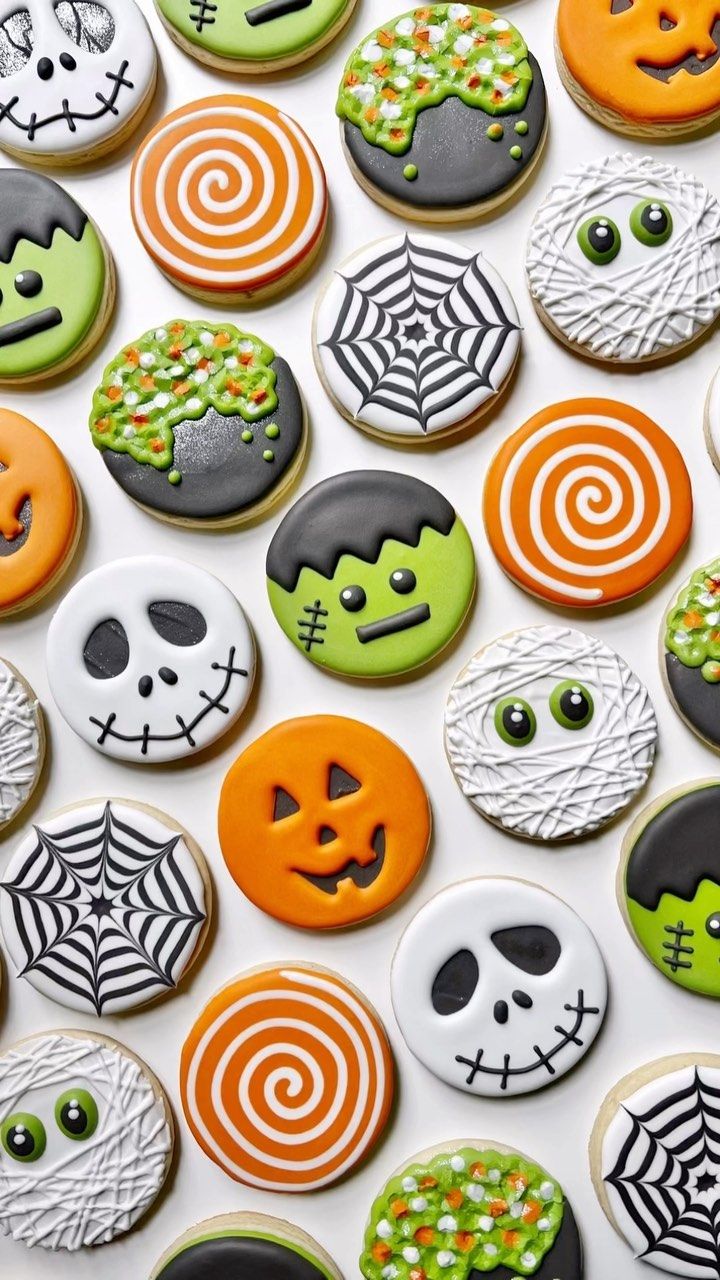 halloween cookies decorated with icing and sprinkles