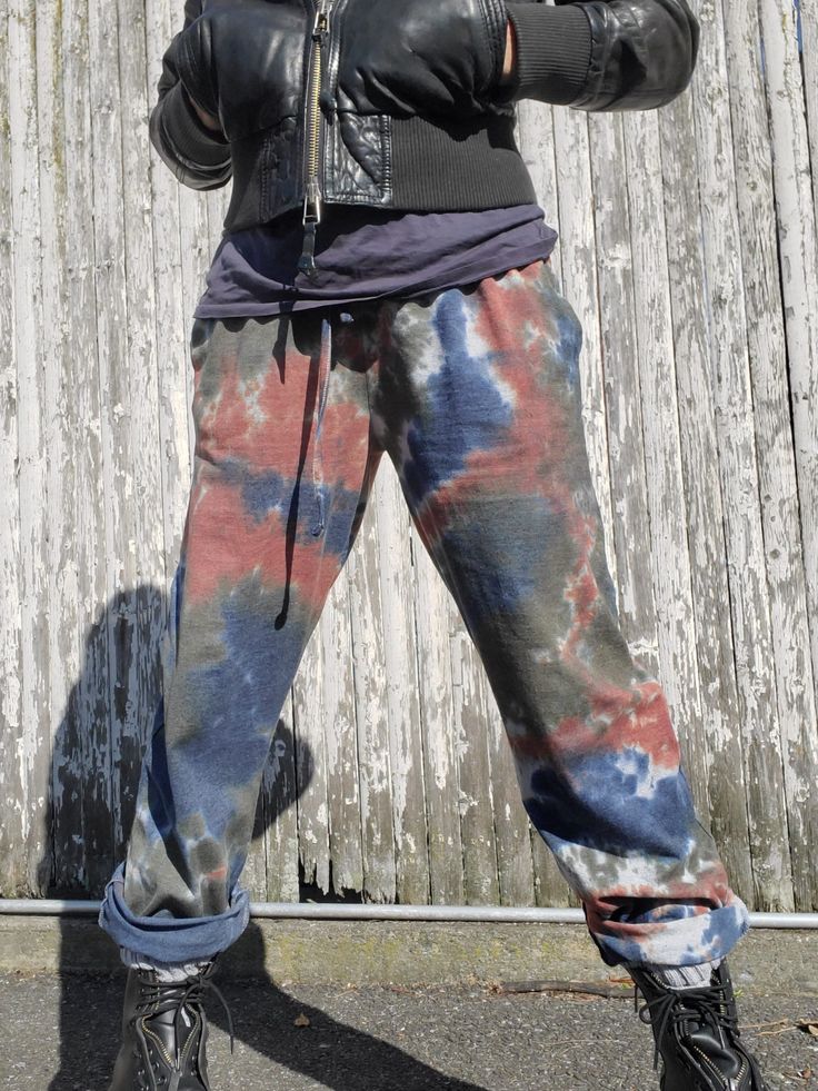 "Unisex Lounge Pants, PJs in Tie Dye Cotton comfy pants with pockets and drawstring. Boyfriend Pants, Streetwear Style  Wear these at home, or work them into a funky casual outfit! I am the model for these, a size s/m, wearing a medium for a baggier fit (I meant it for somebody else to model these - a guy.) Color Combo Name: SHANTI rust-olive-navy on the heather grey fabric This listing is for the PANTS ONLY! Available Sizes: S, M, L, XL, 2XL, 3XL Measurements  Waist (not stretched): 14\", 15\", Pantalon Boyfriend, Funky Shirts, Boyfriend Pants, Tie Dye Mini Dress, Pants Streetwear, Somebody Else, Tie Dye Cotton, Comfy Pants, Pants With Pockets